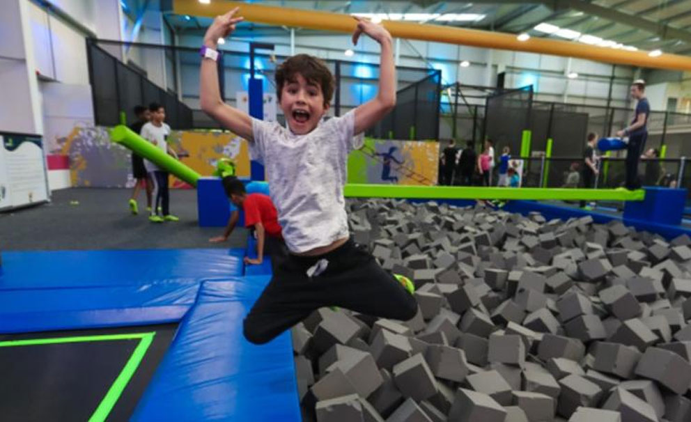 kid at jump in trampoline park